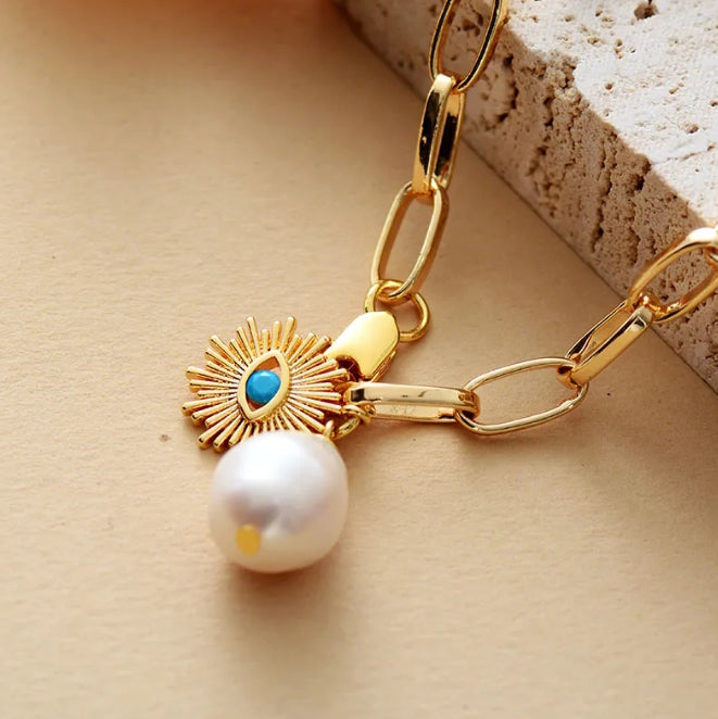 Necklace with Freshwater Pearl and Turquoise Eye Pendant: Balance and Protection